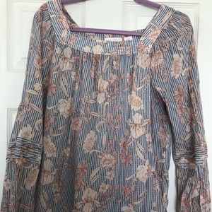 Square neck, long sleeved blouse.